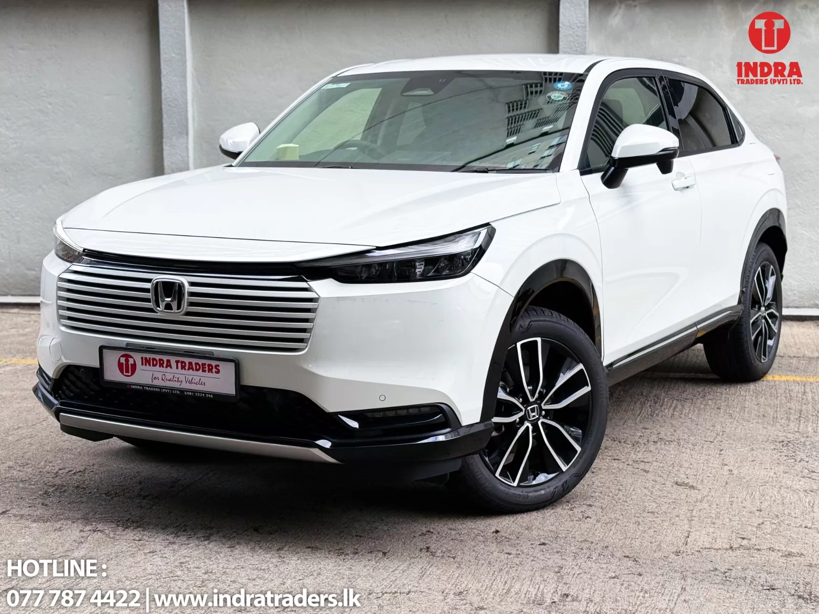 White Honda SUV shown in a front-left three-quarter view, with Indra Traders watermark in the top-right and contact info along the bottom edge.