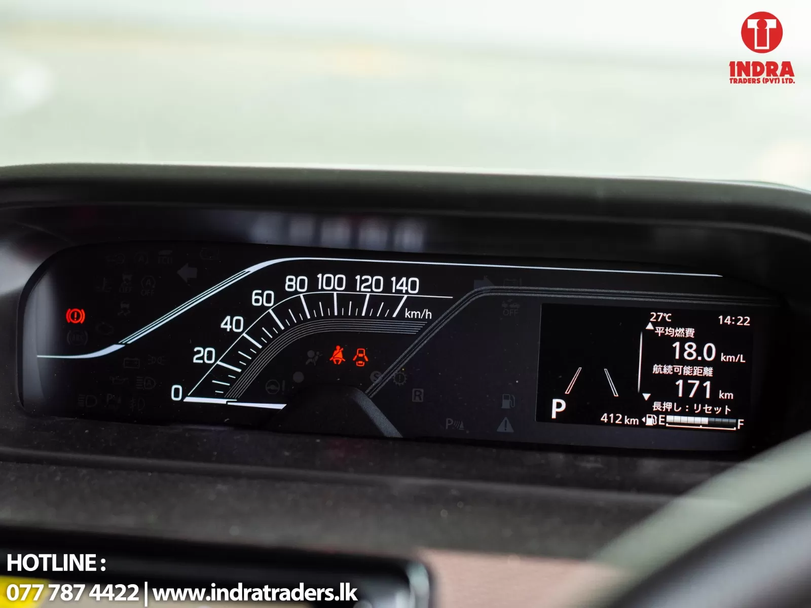 Car dashboard with a speedometer up to 160 km/h, red brake warning light on, and a right-side display showing 18.0 km/L fuel efficiency and 171 km range.