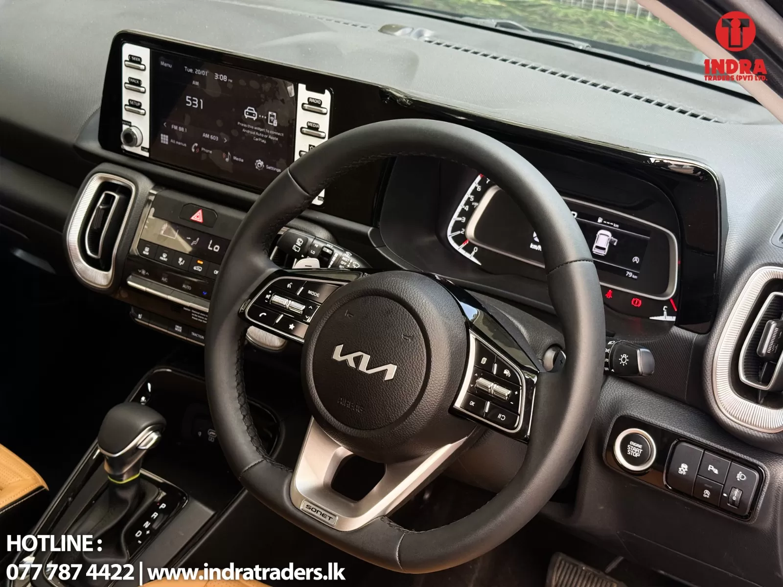 Interior of a modern car showing a round steering wheel, digital instrument cluster, and large touchscreen infotainment panel.